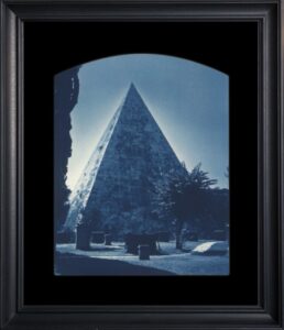 Framed photograph of a pyramid structure.