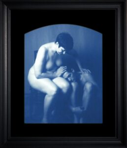 A framed artistic photograph of two people.