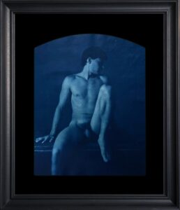 Nude male figure in artistic pose.