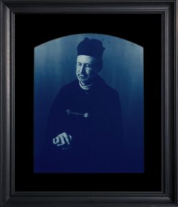 Portrait of a man in blue monochrome.