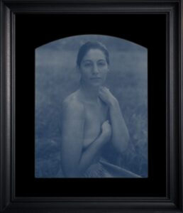 Portrait of a woman in blue tint.
